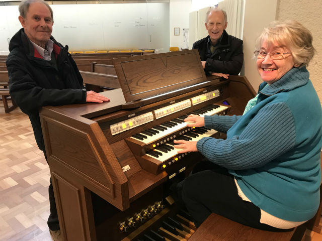 Terry, Diana and Reg at the console of their new Viscount Envoy 35-F organ