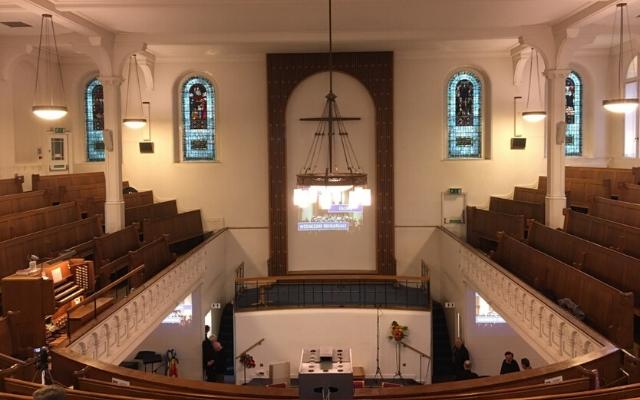 Central Baptist Church interior, with the detached organ console in the gallery
