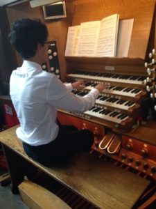 Dominic Remedios playing the pipe organ at Leicester Cathedral