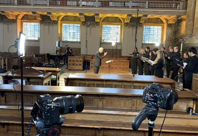 Cameras pointing at organist