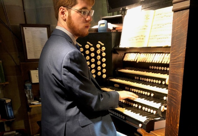 Cassian playing the organ at Hereford Cathedral