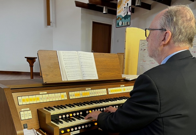 Organist, Roger Tempest playing Ensign 42-FV