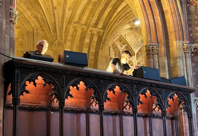 Roger and Steve wiring speakers on top of the north choir stalls