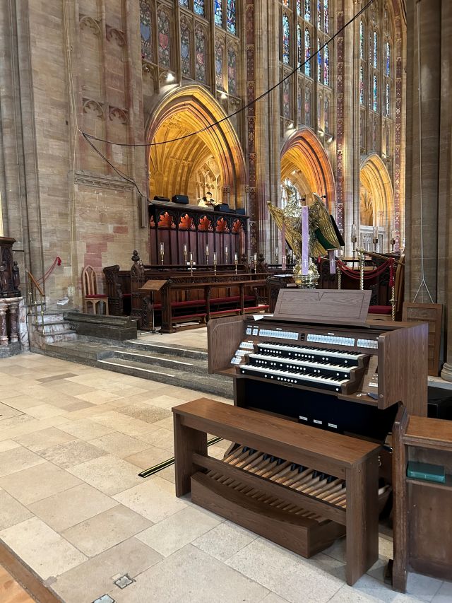Viscount Envoy 350 organ console in place, with Steve wiring up speakers on top of north choir stalls.